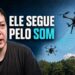 Carlos Melo diante de dois drones em voo e da frase Ele Segue pelo Som